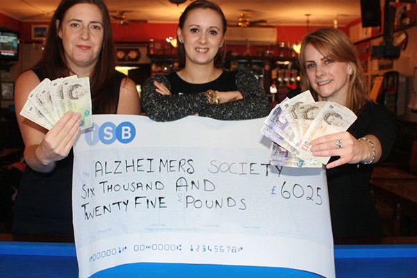 Gemma hands over cheque to Alzheimer’s Society