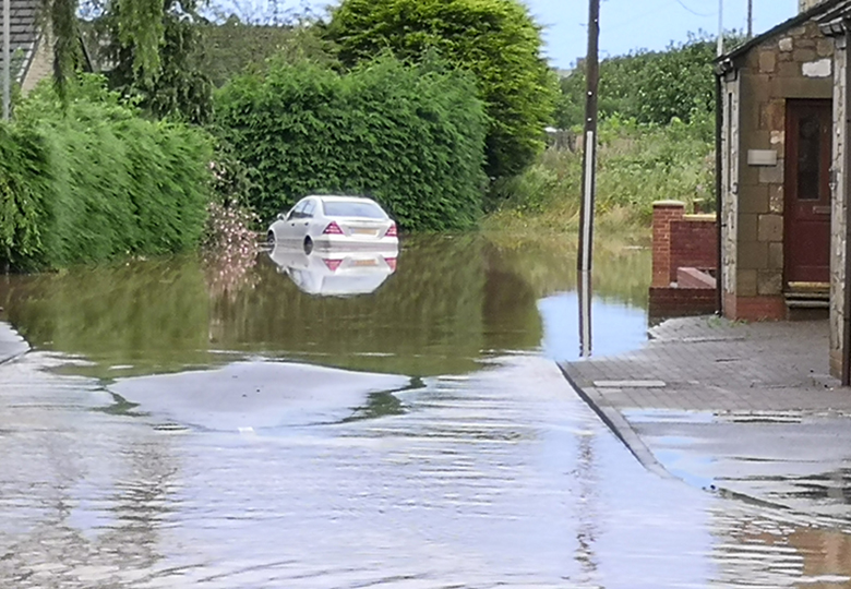 Car in floods at Amble