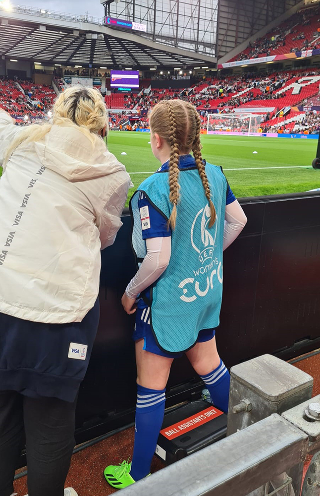 two females assist at UEFA football match