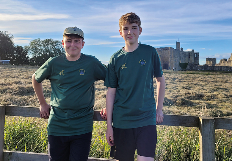 two boys in front of Warkworth castle