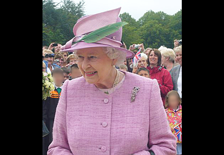Her Majesty the Queen visiting Alnwick in 2011. She wore a pink hat with a green feather and a pink jacket