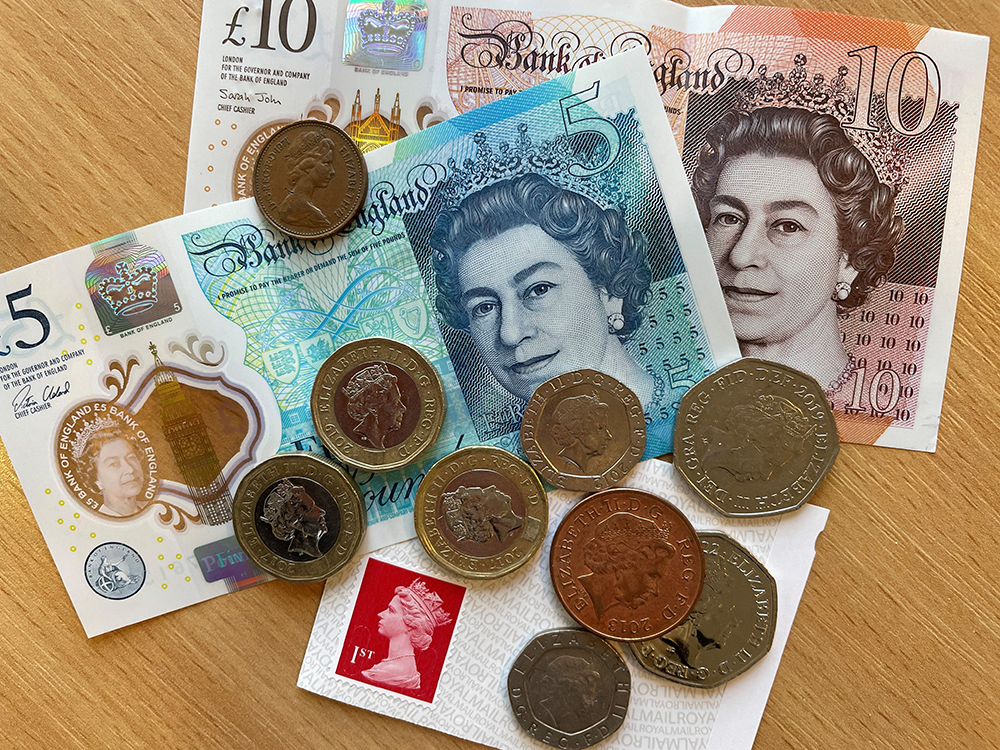 Money and stamps with Queen Elizabeth's head