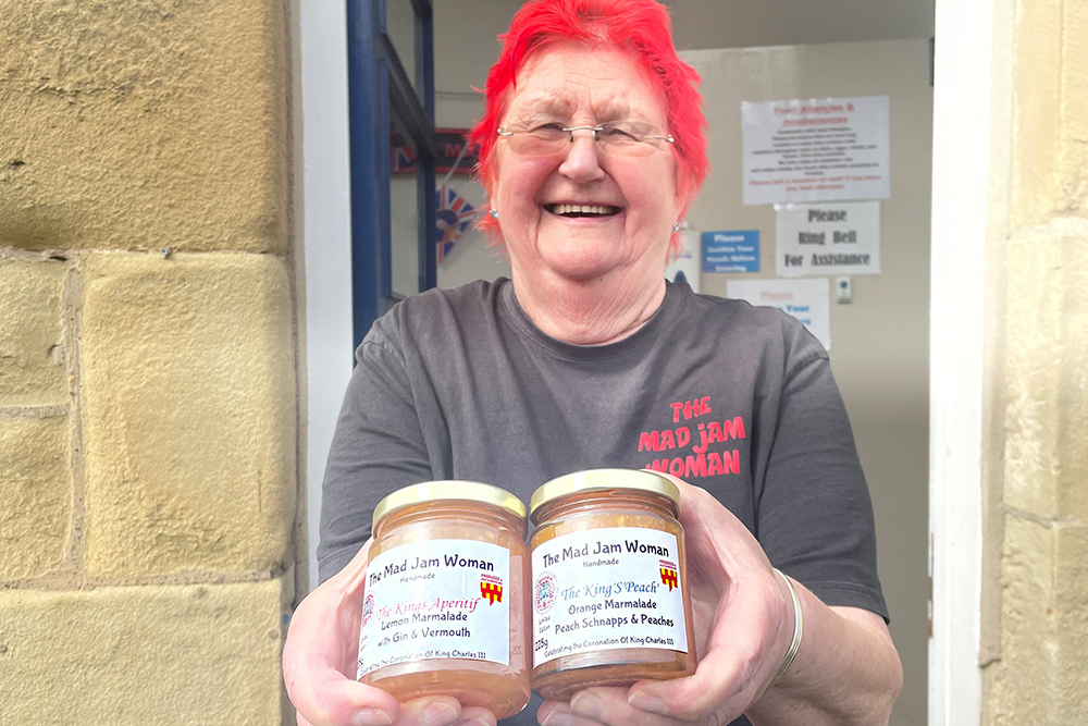 Sandy Higson holds two jars of marmalade
